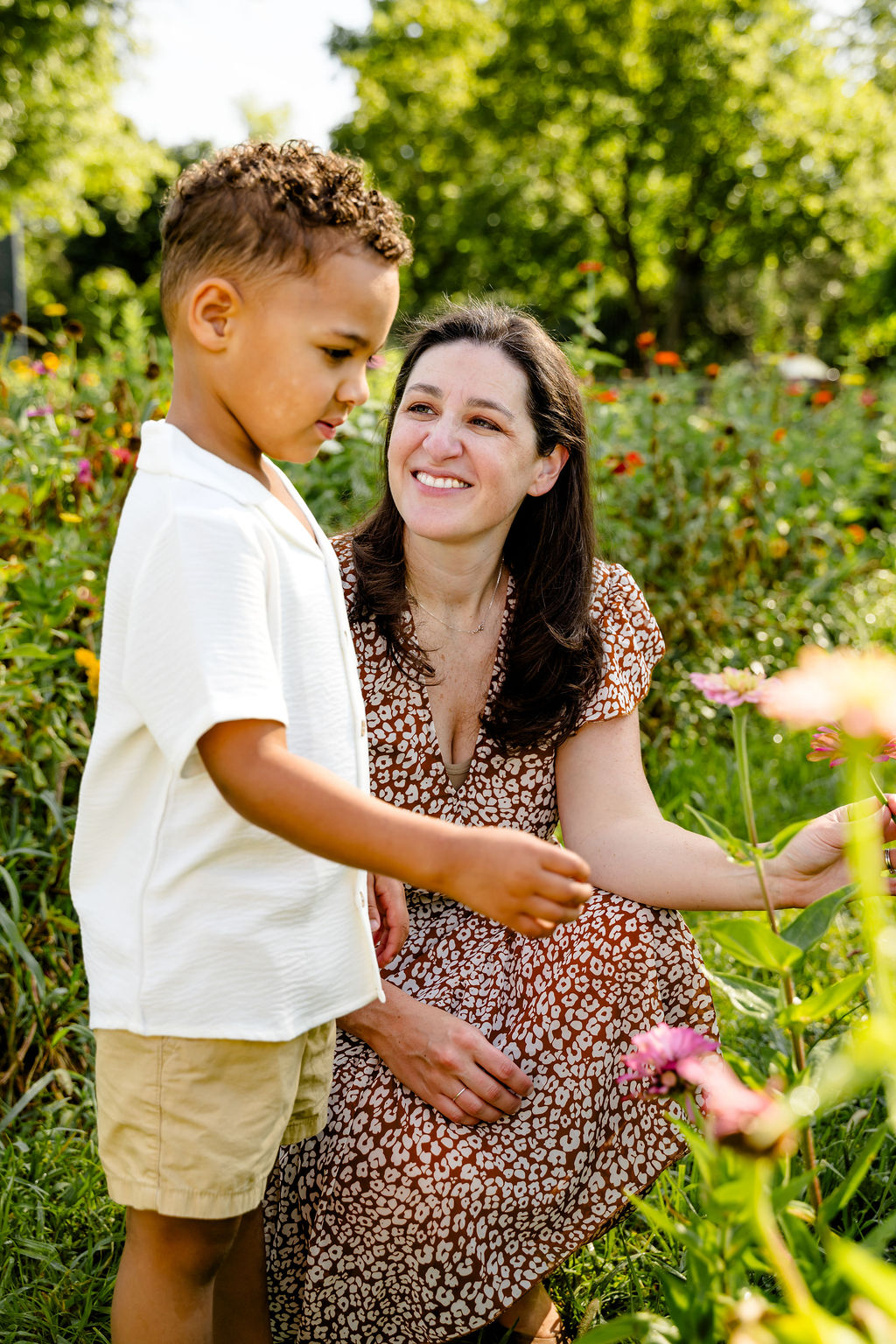 Stand-in: a mom and her son exploring a flower garden